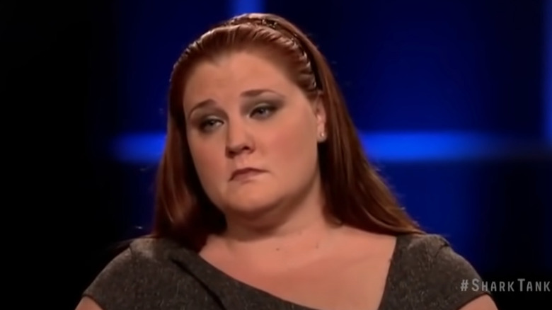 Deidrea Haysel on Shark Tank looking annoyed while pitcing Hot Mama Gowns