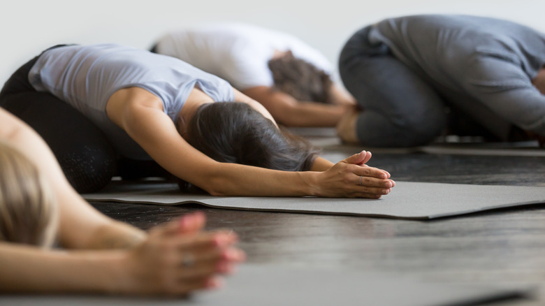 People performing child's pose