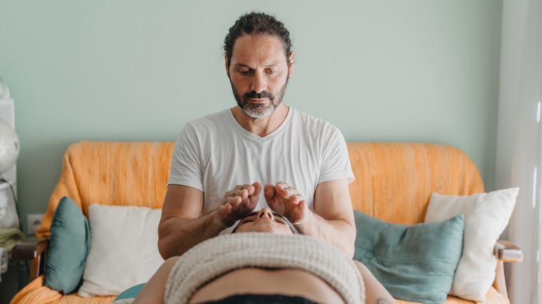 Reiki therapist in session