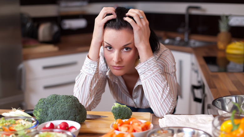 woman in kitchen depressed