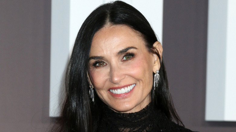 Demi Moore in a black dress smiling for a photo at the  Landmark Paramount+ Series Premiere
