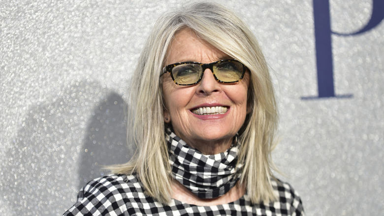 Diane Keaton attending the premiere of STX's "Poms" in a checkered black-and-white outfit with a neckscarf