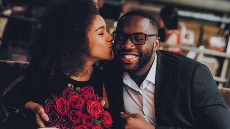 couple kissing on a date