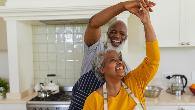 couple dancing in kitchen