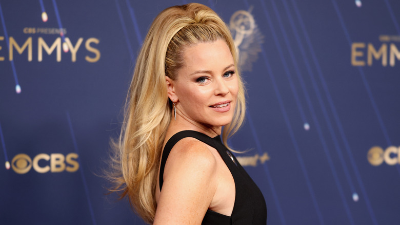 Elizabeth Banks posing on the Emmys red carpet