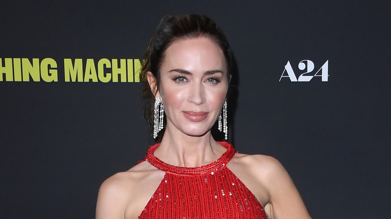 Emily Blunt wearing a red dress