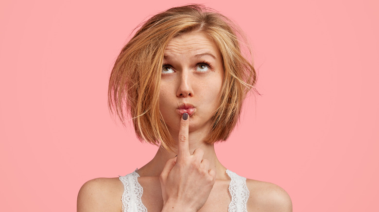 Woman with short hair looking up