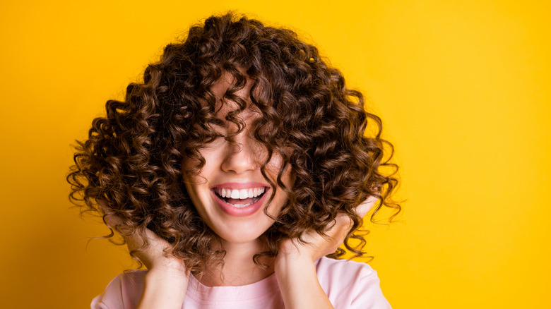 brunette with bouncy healthy curls