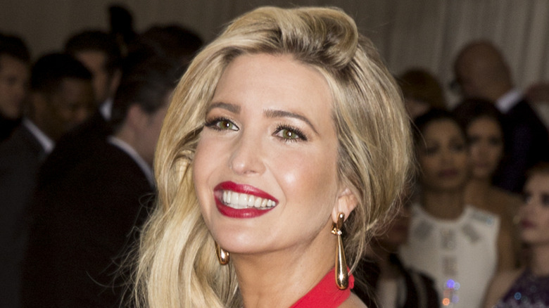 Ivanka Trump smiling in a red dress