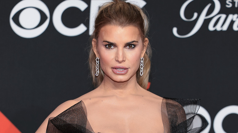 Jessica Simpson posing on the red carpet at the 2025 MTV VMAs