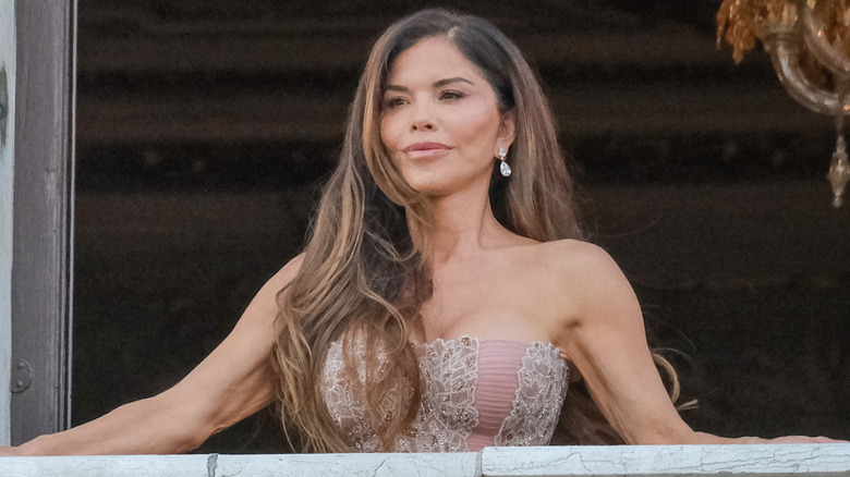 Lauren Sánchez standing on a balcony in Venice, Italy, during her wedding weekend with Jeff Bezos