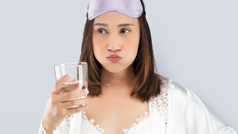 Woman doing a mouth rinse