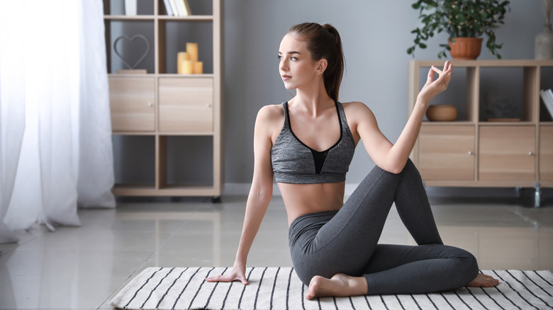 woman doing yoga at home