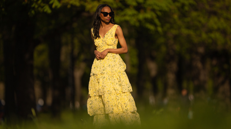 Woman walking through a forest
