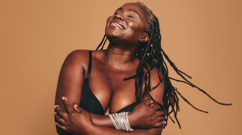 woman in bra loving her body