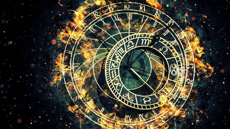 zodiac chart surrounded by fire