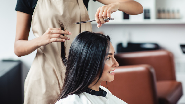 Woman getting haircut