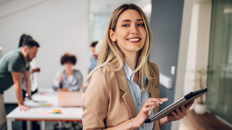 Smiling businesswoman using tablet