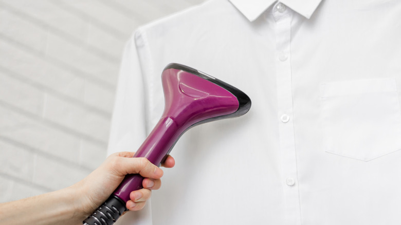 person steaming white shirt