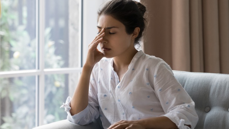 Sad woman sitting on chair