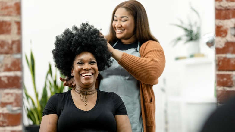 A hairstylist cutting a client's hair