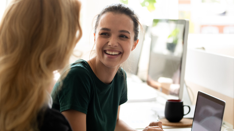 Women having conversation at work