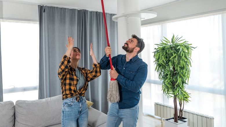 Couple with noisy neighbors hitting ceiling