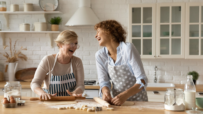 Two women cook together