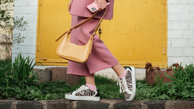 woman walking in sneakers