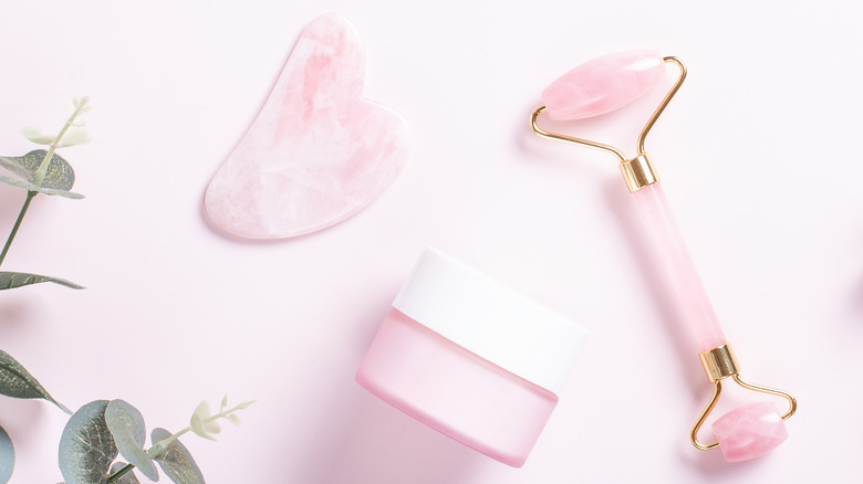 pink jade roller, gua sha and cream