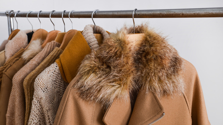 Coat on rack with imitation fur collar
