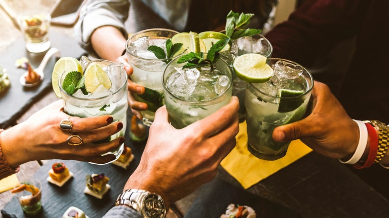 Group toasting with cocktails