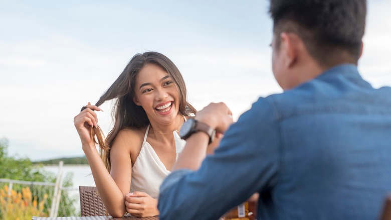 Woman flirting with date
