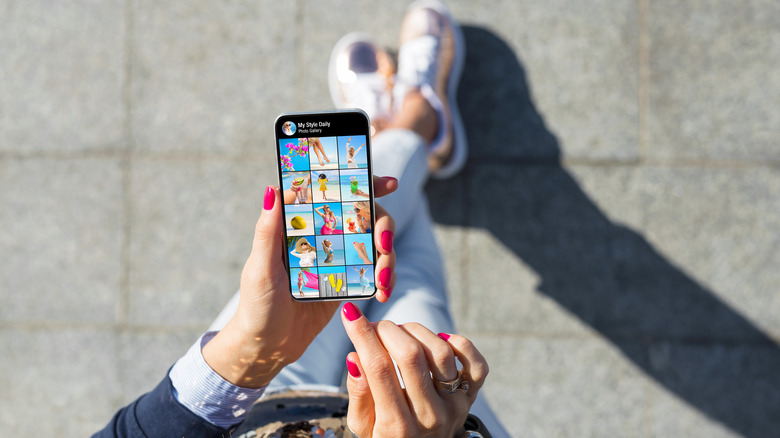 woman looking at phone apps