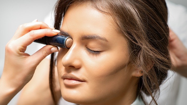 woman using contour stick