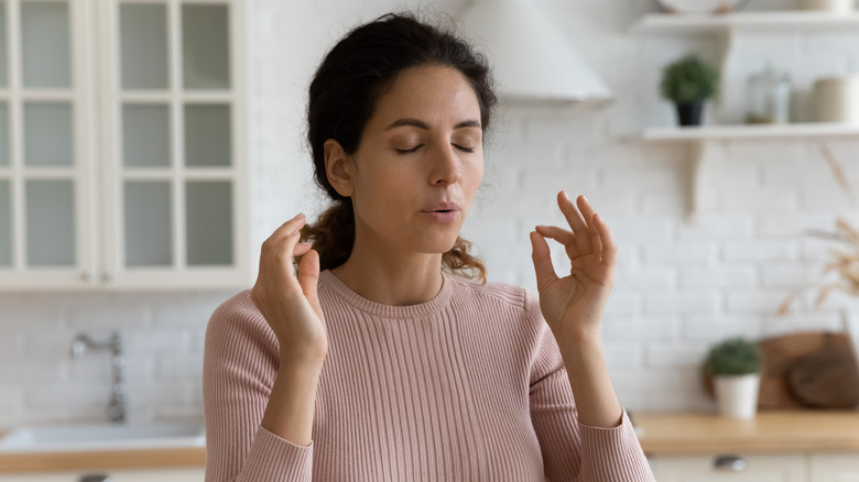 Woman taking deep breaths