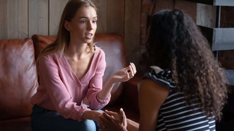 Woman giving her friend advice 