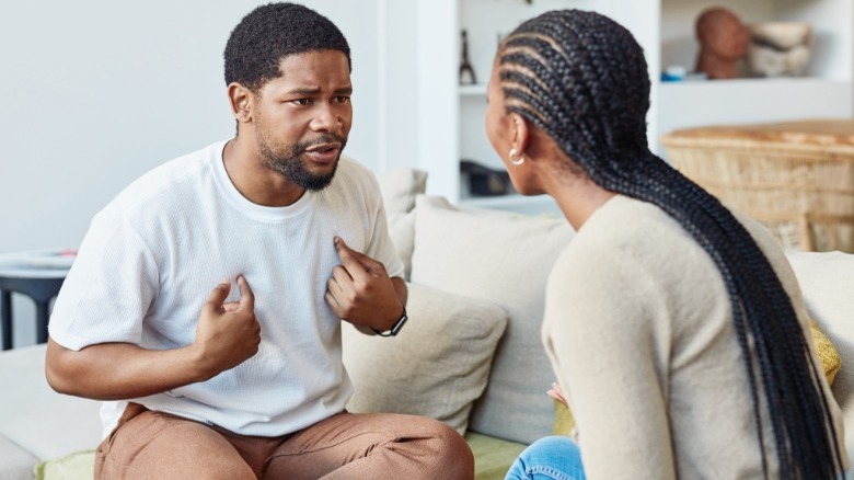 Couple arguing on couch