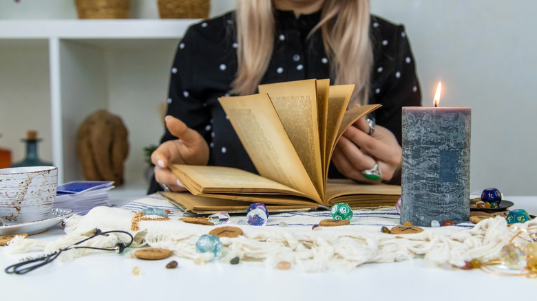 Woman studies astrology book