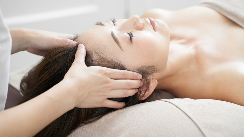 woman receiving head massage