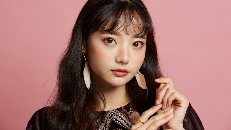 Woman models Japanese blush technique 