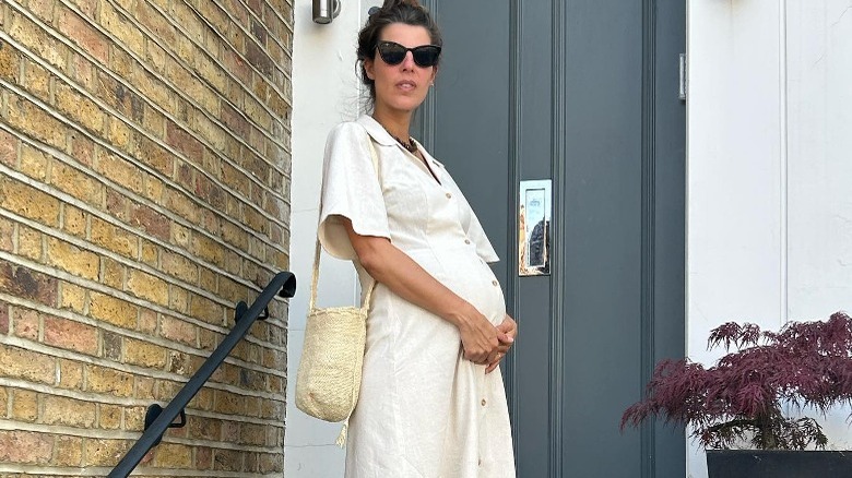 Person in bun and linen dress