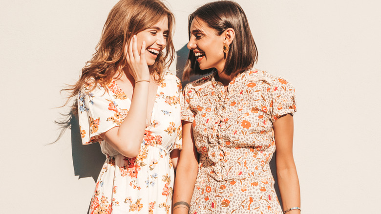 two women wearing sundresses