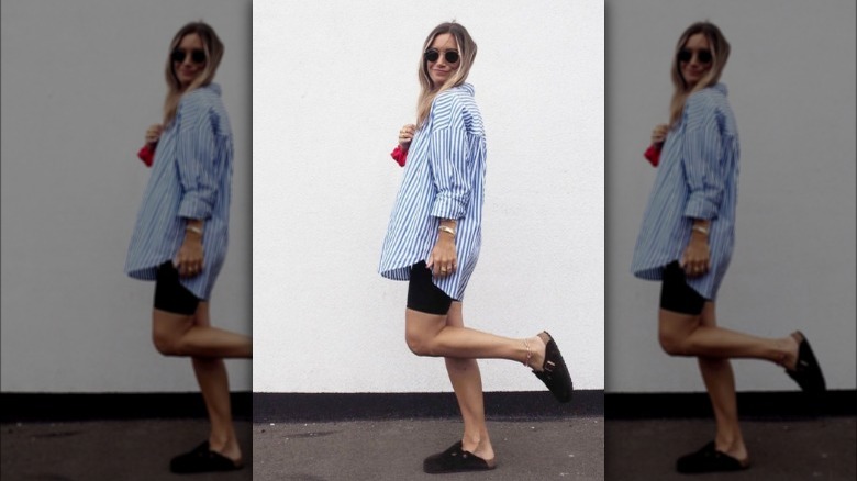 Woman wearing bike shorts with button-up