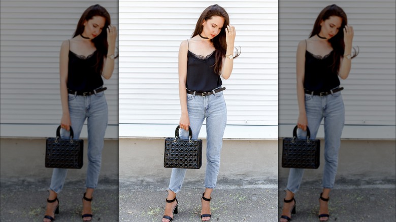 Woman wearing black belt and denim