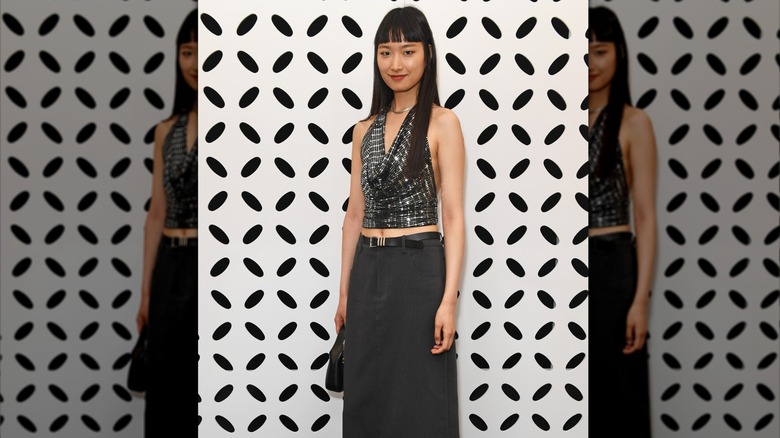 Han Wang wearing thin black belt