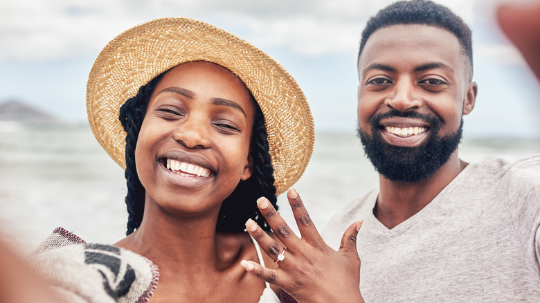 Engaged couple at beach