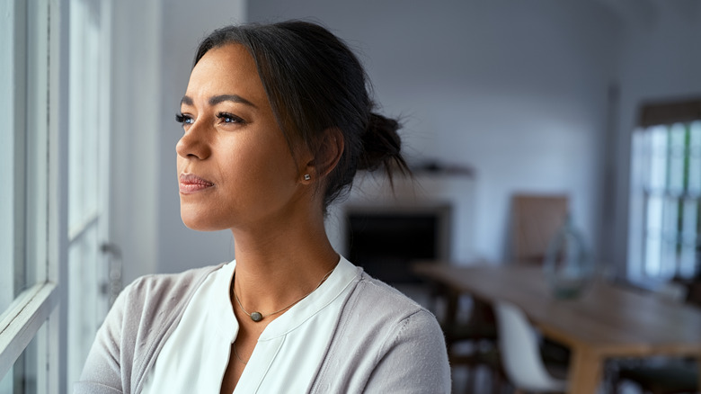 Woman looking out the window