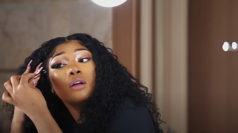 Megan Thee Stallion applying lashes