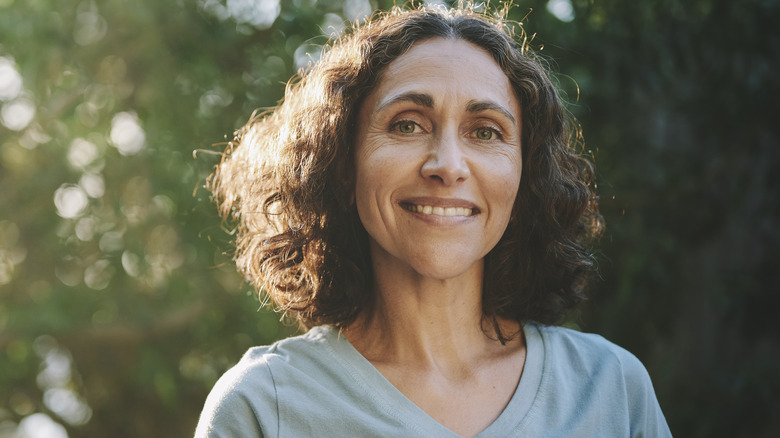 Woman smiling outside